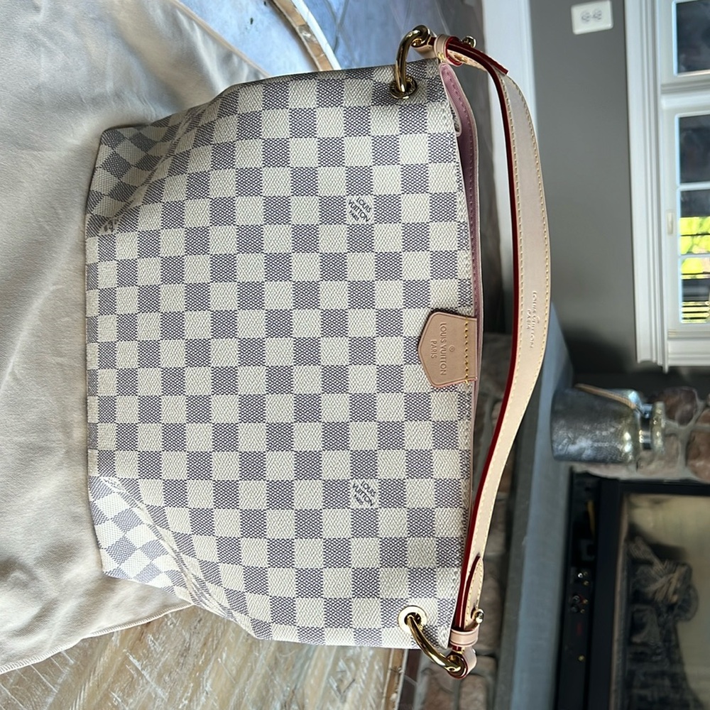 Women’s cream Louis Vuitton bag. Never been used.